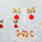 Elegant Christmas bow earrings – gold diamanté design with red drop ball