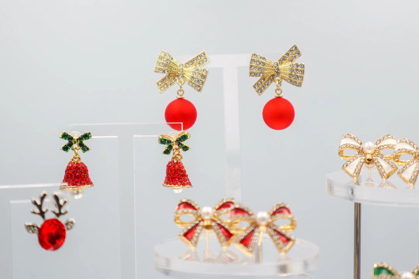 Elegant Christmas bow earrings – gold diamanté design with red drop ball