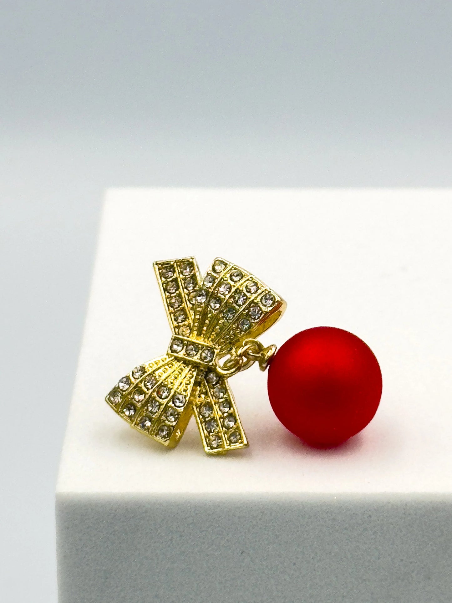 Statement festive earrings – red ball drop with gold diamanté bow top