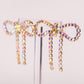 Iridescent Gold Diamanté Wide Bow Earrings