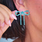 Teal Diamanté Wide Bow Earrings