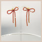 Diamante Bow Earrings - Red & Gold
